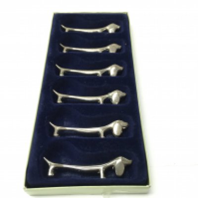 A set of french chrome knife rests in the form of dogs. 6 in total. Postage B