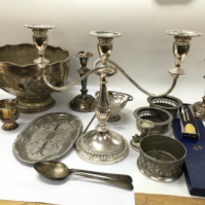 A collection of assorted silver plate and other items including trophies candlestick holders etc. Postage C
