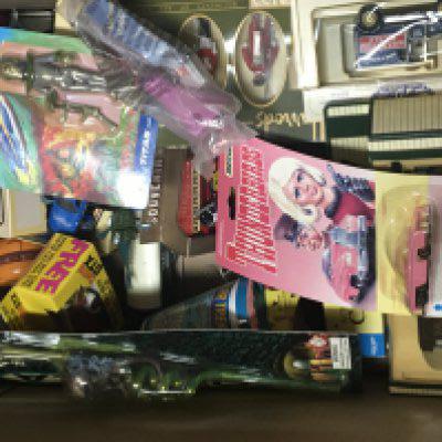 A box containing a collection of toys carded Matchbox Stingray Thunderbirds trains and boxed cars