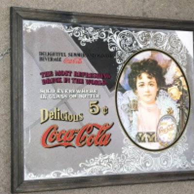 A vintage American Coca Cola advertising mirror. Dimensions 58x48cm This lot cannot be posted. NO RESERVE