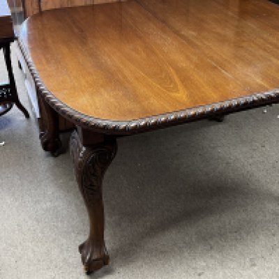 A reproduction Mahogany chippendale style dining table and 6 chairs. NO RESERVE