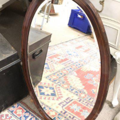 A wooden inlaid oval mirror,80cm tall 50cm wide. NO RESERVE