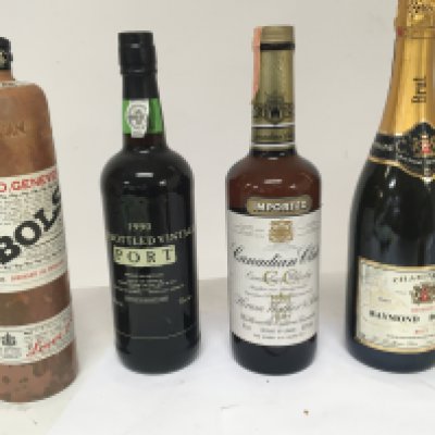 A bottle of 1990 Vintage Port a bottle of Canadian Club Whisky a bottle of Raymond Boulard Champagne and a bottle of Bols (4). NO RESERVE