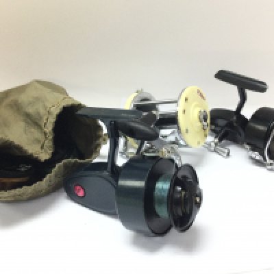 A collection of vintage Garcia fishing reels including a Mitchell 301, 600 & 406. Also including spools with fishing line.