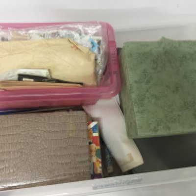 A box containing a collection of world stamps loose a d hinged on sheets from Queen Victoria to Elizabeth II and a quantity of cigarette a d tea card albums and some decimal British presentation packs. NO RESERVE