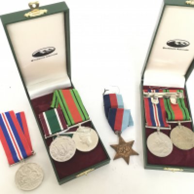 A collection of medals including a 1939-45 star, The Defence Medal & a copy, The War Medal & a copy, Womans Royal Voluntary service medal. Postage category A. NO RESERVE