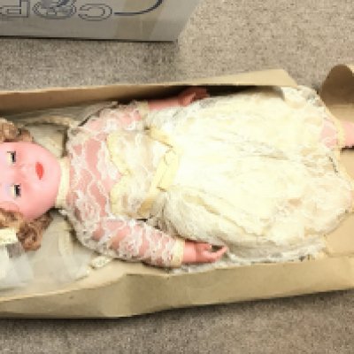 A boxed vintage mid 20th century doll. Postage category C. NO RESERVE