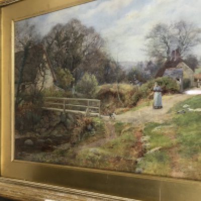 A framed watercolour country side view wit stream bridge and figure. 42 cm x 62cm. NO RESERVE