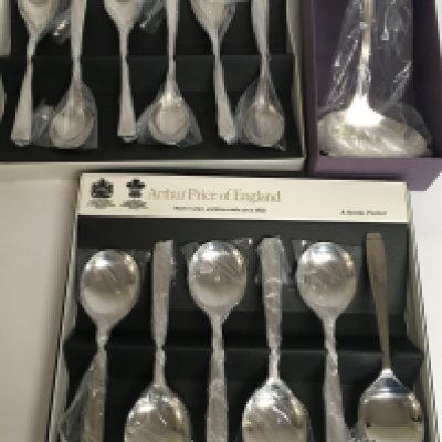 A collection of boxed Arthur price cutlery including spoons and a ladle. Postage cat C- NO RESERVE
