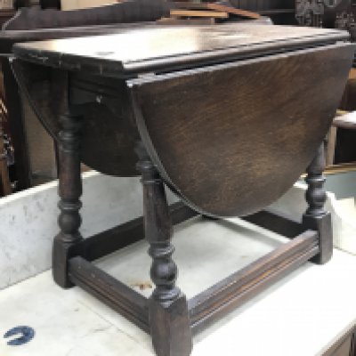 An oak drop leaf table , dimensions 25x56x44cm. NO RESERVE