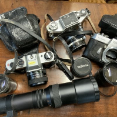A good selection of cameras to include Exacta VX1000, Yashica, Practica and lenses.