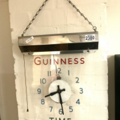 A 1950s electric operated perspex clock 'Guiness Time, height 40cm x width 32cm