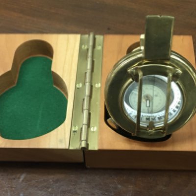 A vintage brass compass with presentation box.