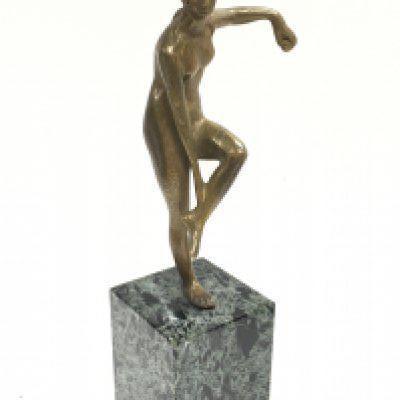 A bronze Art Nouveau figure of a nude woman bather on a square green and black marble base, 21cm tall. Postage category B