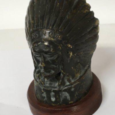 WITHDRAWN - A cast bronze car Mascot in the form of an Indian chief GUY Father in our car on a later mahogany plinth. Height 15cm.