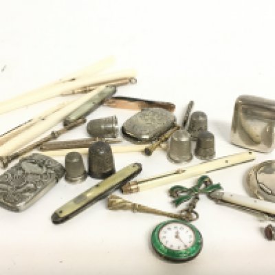 A collection of silver thimbles, a silver hallmarked vesta case, silver fob watch, bone items and a 12 carat gold penknife. Postage category A