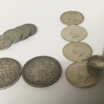 An 1879 American dollar An 1896 Victorian Crown four 1964 Kennedy half dollars other American coins and spoon.