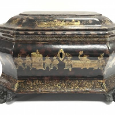A Chinese black lacquer box with gilt decoration and dragon head feet, dimensions 25x19x16cm approximately. Postage category C