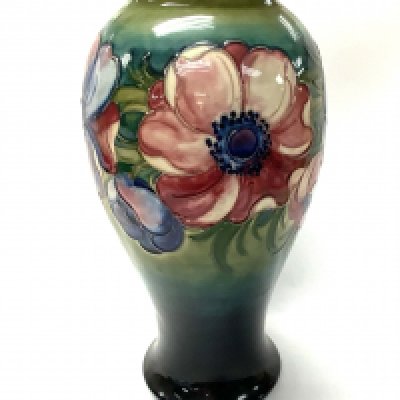 A large 20th Century Moorcroft vase in anemone pattern, Walter Moorcroft initial mark, impressed Moorcroft mark to underside, 27cms high approx. Condition : No damage or repairs, tiny chip to flower. 31cm. (Postage D, not available in house).