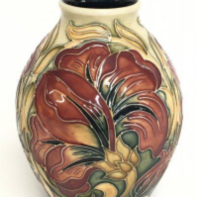 A Moorcroft Spanish vase. 14cm tall. No obvious damage or restoration, this lot cannot be posted.