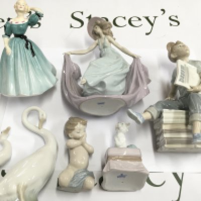 A collection of seven figures including Lladro NAO and Royal Doulton. Postage D.