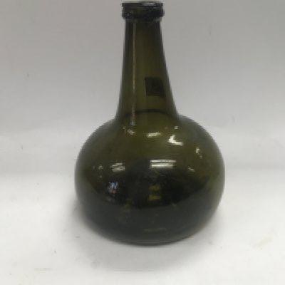 A free blown onion wine bottle circa 1680-1700.