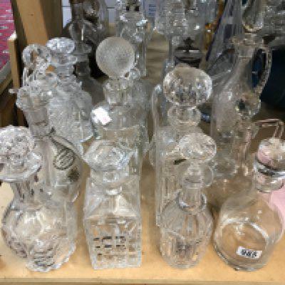 A large collection of cut glass decanters. Approx 20 decanters.