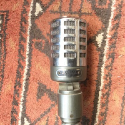 A circa 1960s Reslo ribbon microphone with pneumatic pump microphone stand. All original parts.