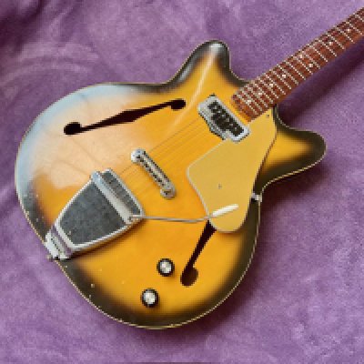 A 1966 Fender Coronado I semi solid electric guitar with original parts plus added 1960's Stratocaster Tremolo Arm and modified tailpiece. Overall in very good condition with light play wear consistent with age and use. Light marking and paint chips to the back otherwise very good overall. Light fret wear. No case.