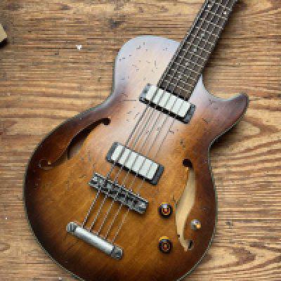 An Ibanez Artcore 5 String Bass Guitar with distinctive Ibanez finish in non original case - condition very good.
