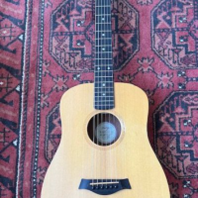 Taylor Guitars Baby Taylor acoustic guitar in flame maple in good condition with soundhole playwear to top. Otherwise overall very good condition. Comes with Taylor gig bag.