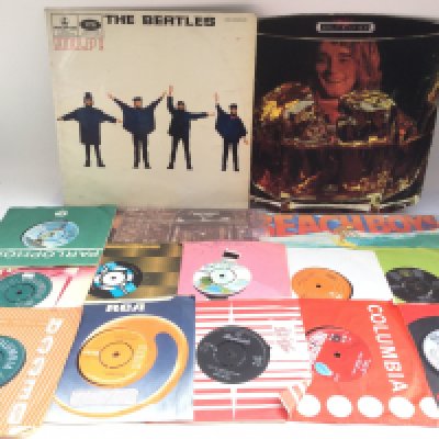 A small collection of LPs and 7inch singles by various artists including The Beatles, The Who, Jackie Wilson and others.