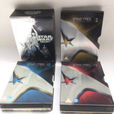 Three Star Trek original series steel book DVD sets and a Star Wars Trilogy DVD box set (4).