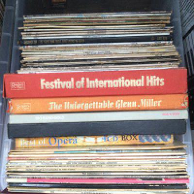 A box of LPs comprising jazz, blues and classical titles.