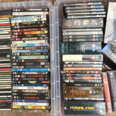Two boxes of CDs and DVDs and BluRays by various artists including Adele, Manic Street Preachers, Beyonce and others. DVDs include some box sets such as 'Game Of Thrones' seasons 1-7.