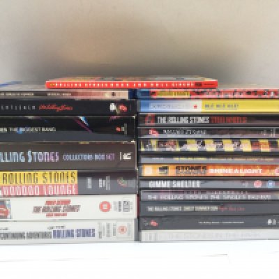 A collection of Rolling Stones DVDs, BluRays and VHS tapes.