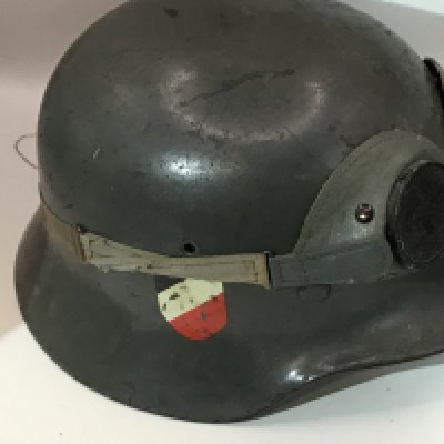 WW2 German Army (Heer) M35 Double Decal Steel Combat Helmet, fine example retaining much of the original apple green paint finish to the shell. Complete with original German army (heer) eagle decal and national tri-colour With leather liner and interior stamp marks sold with a pair of authentic German general purpose googles.