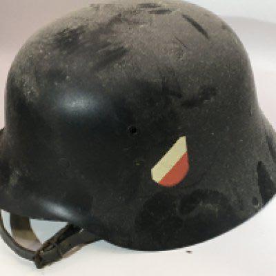 A German Third Reich steel helmet M42 pattern with side decals black finish and liner.