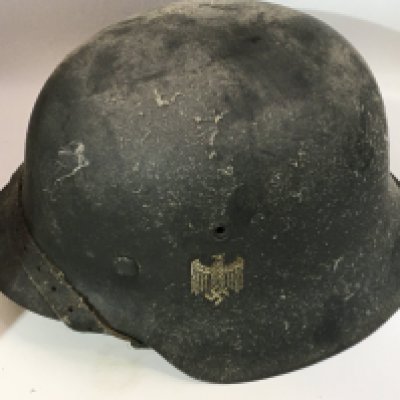 A German Third Reich steel helmet M42 pattern with single decal leather lining and interior edge stamp marks.