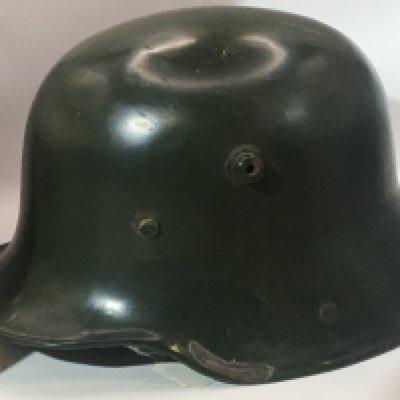 A German I world war M16 pattern helmet original green colour with scuffs repressing use in the battle field no liner.