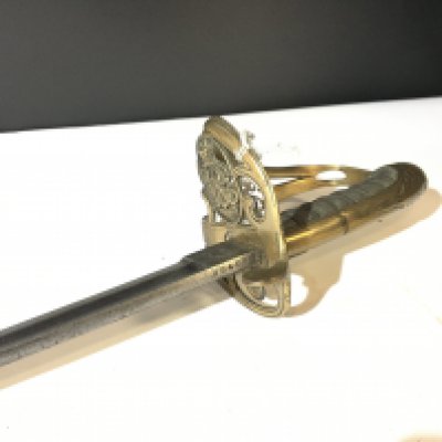 A Victorian officers sword with a brass grip and numbers blade 20427 wired shagreen grip.no scabbard.