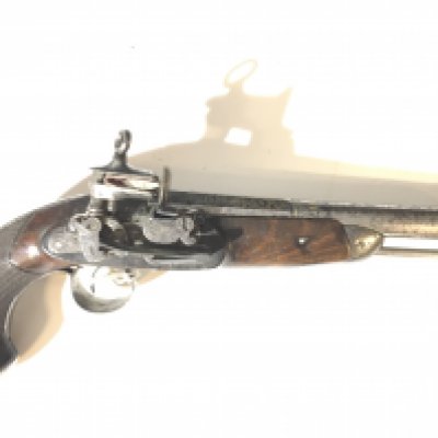 An early 19th century Continental flintlock pistol the steel barrel with impressed marks and inscription rabricado 1818 with attached steel belt clip length 34cm