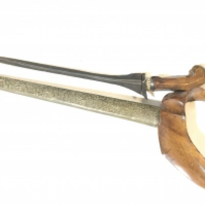 An Indonesian Kris Knife with carved wood grip and patterned scabbard. Good condition