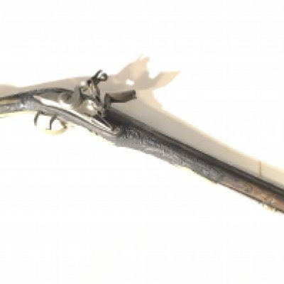 A French or Spanish late 18th century Flintlock pistol with a carved walnut stock and ornate brass mounts steel barrel and and functional action good condition for age.