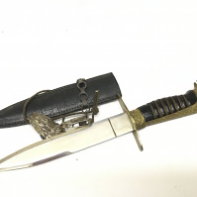 An unusual German Third Reich type dagger with an eagle head pomel with gilt metal glass eyes and wired grip with attached fitting leather scabbard. Length 29cm