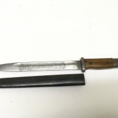 An unusual German Third Reich bayonet K98 Waffen SS with etched blade and plain wood grip. Length 40cm