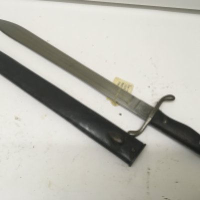 A Short Sword with butcher type steel blade wood grip the blade stamped Modelo Argentino 1909 the cross guard and scabbard with conforming serial number and in very good condition. length 51cm