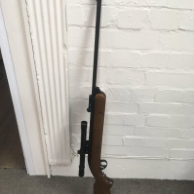 A BSA mercury air rifle MK 1.77 1971-1973 with an attached 4x20 bsa scope.