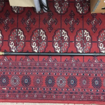 An ebonised sword stick blade approximately 60cm long , total length 74cm. The collar works as a lock function, twisting to release the blade section of the stick. This lot cannot be posted