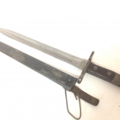 A Swiss model 1918/55 bayonet maker Waffenfabrik Neuhausen the double edge blade 30cm long the cross guard stamped 748065. With metal scabbed.